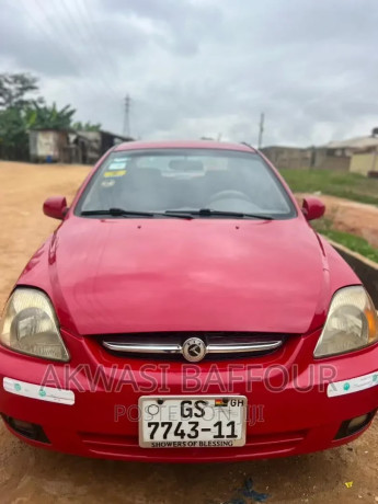 kia-rio-2010-red-big-0